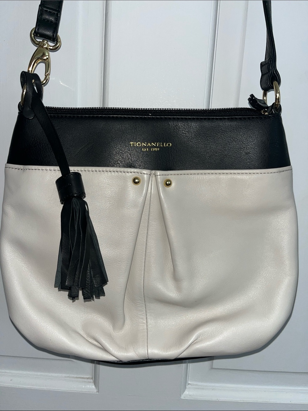 Tignanello Black and Cream Leather Tassel Shoulder Bag